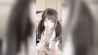 Cute girl with pretty pigtails masturbates by rubbing her breasts and touching her pussy.
